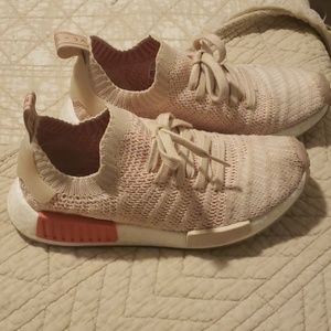 Adidas NMD coral and light beige shoes.